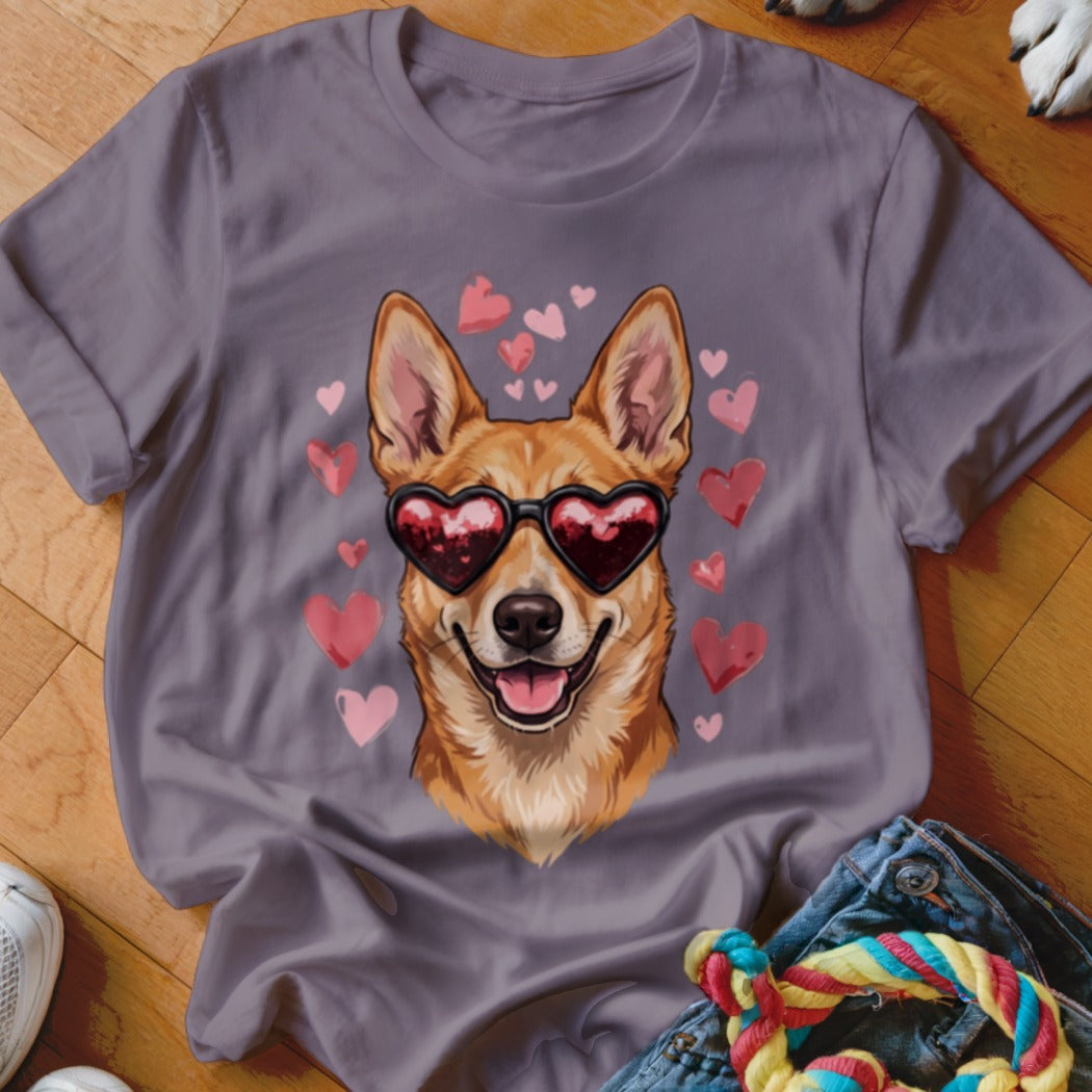 A grey t-shirt featuring a graphic of a brown dog wearing heart-shaped sunglasses surrounded by pink hearts.
