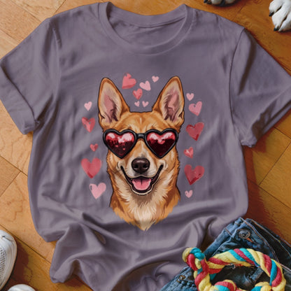 A grey t-shirt featuring a graphic of a brown dog wearing heart-shaped sunglasses surrounded by pink hearts.