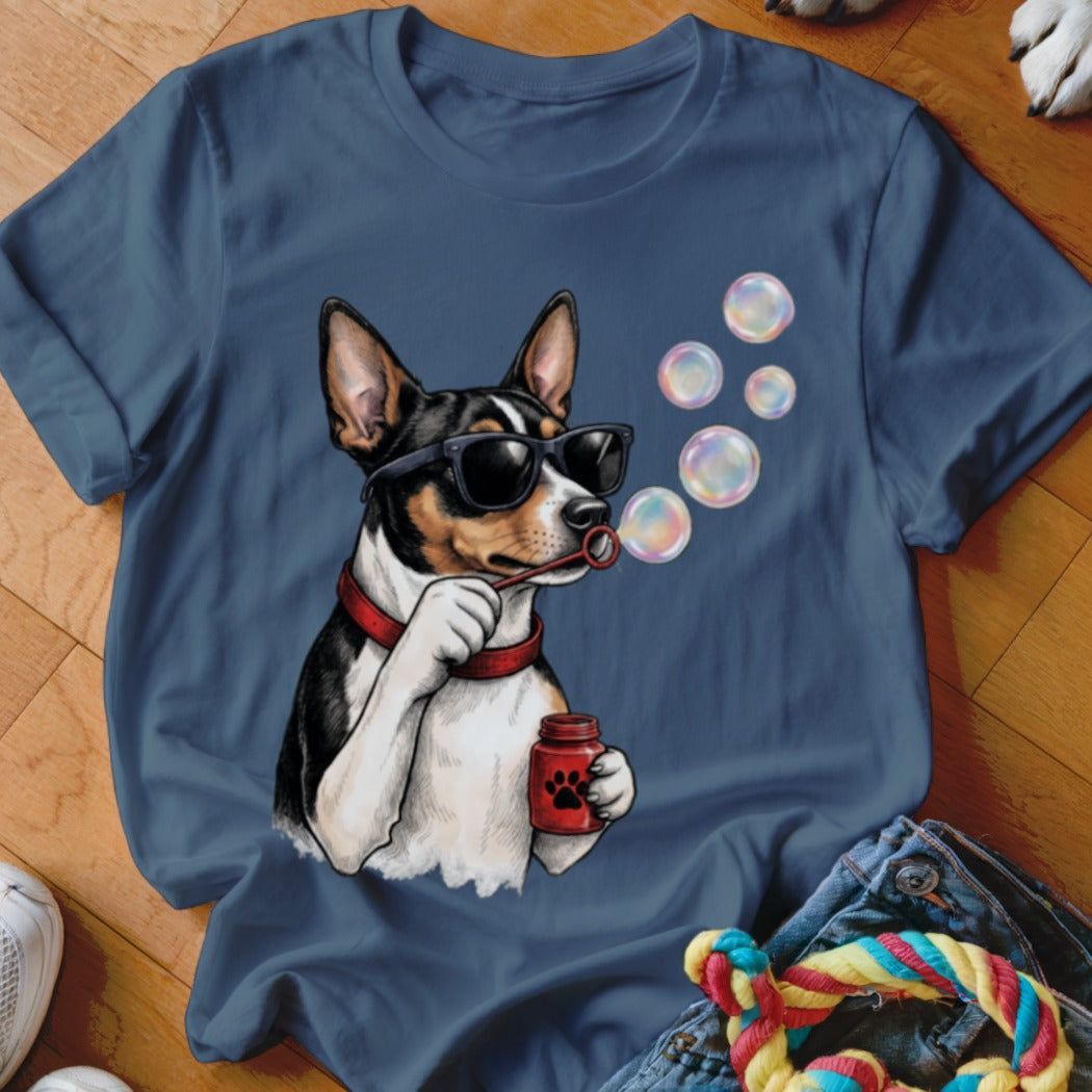 A slate blue crewneck t-shirt featuring a graphic of a dog wearing sunglasses and blowing bubbles.