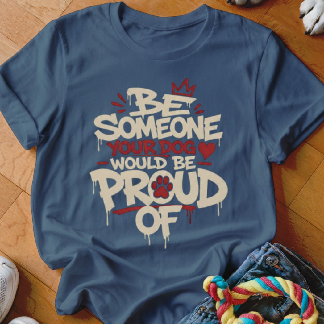 Blue t-shirt with text "Be Someone Your Dog Would Be Proud Of".
