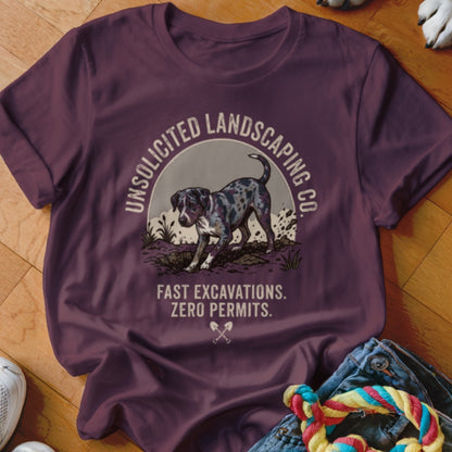 T-shirt with a dog digging, "Unsolicited Landscaping Co." and "Fast Excavations. Zero Permits." text.