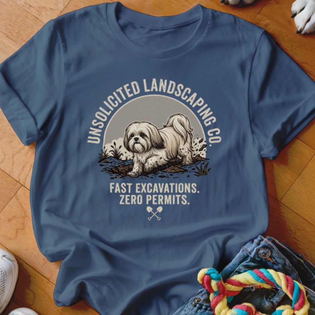 Blue t-shirt with dog digging in dirt, text "Unsolicited Landscaping Co. Fast Excavations. Zero Permits."