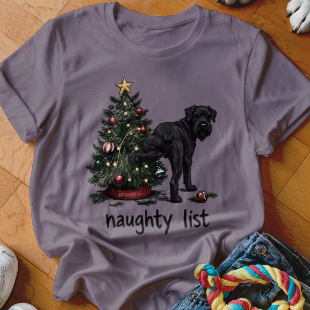Black dog near Christmas tree with "naughty list" text.