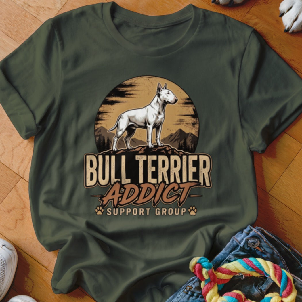 Dark green crewneck t-shirt featuring a graphic of a white bull terrier and the text BULL TERRIER ADDICT SUPPORT GROUP.