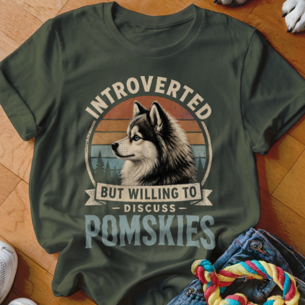 Green t-shirt with husky graphic and text "Introverted but willing to discuss POMS Skies".