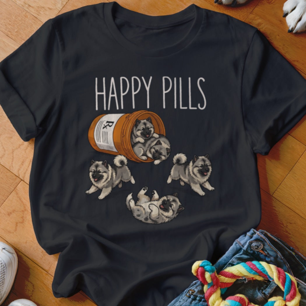 Dark t-shirt with "HAPPY PILLS" and cartoon puppies spilling from a pill bottle.