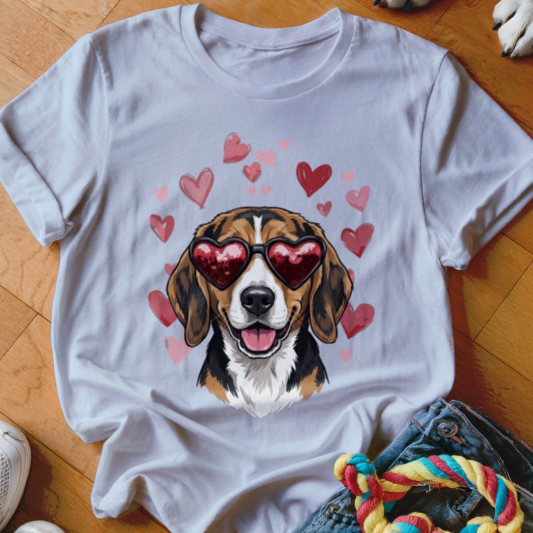 A white t-shirt featuring a graphic of a beagle wearing heart-shaped sunglasses surrounded by pink hearts.