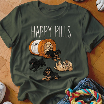Green t-shirt with "HAPPY PILLS" text and cartoon puppies spilling from a bottle.
