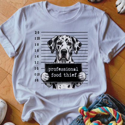 Dalmatian dog with "professional food thief" sign in mugshot background.