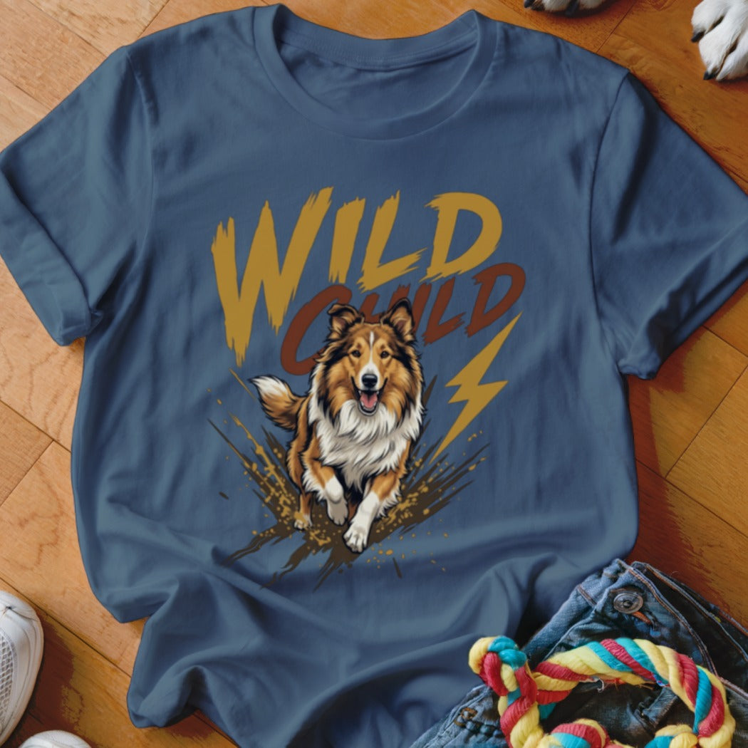 A blue crewneck t-shirt featuring a graphic of a running collie dog and the text WILD CHILD.