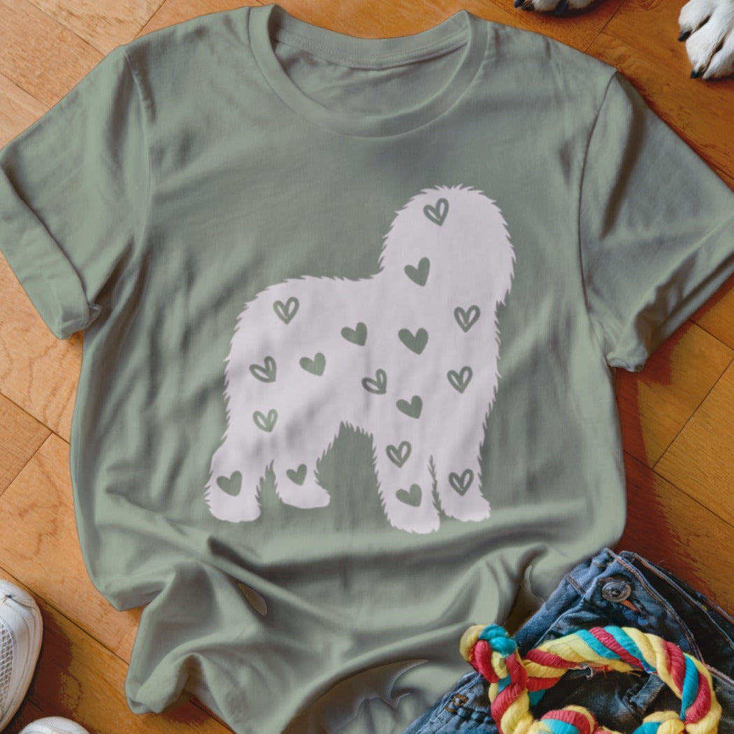 Light green t-shirt with white shaggy dog silhouette filled with small hearts.