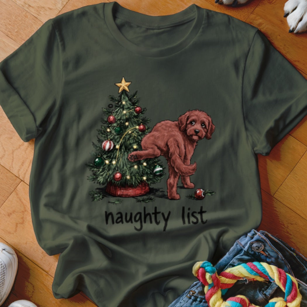 Brown dog near Christmas tree with lights and ornaments, text says "naughty list".