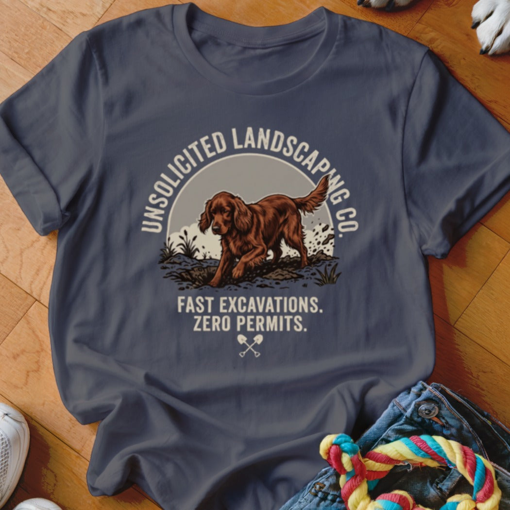 T-shirt graphic with a dog digging and text "Unsolicited Landscaping Co." and "Fast Excavations. Zero Permits."
