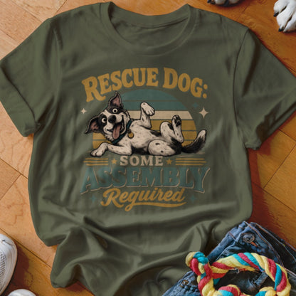 Rescue dog some assembly required graphic on olive green t-shirt.