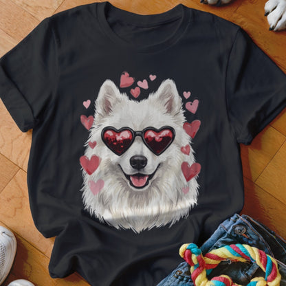 Black t-shirt featuring a graphic of a white fluffy dog wearing heart-shaped sunglasses surrounded by pink hearts.