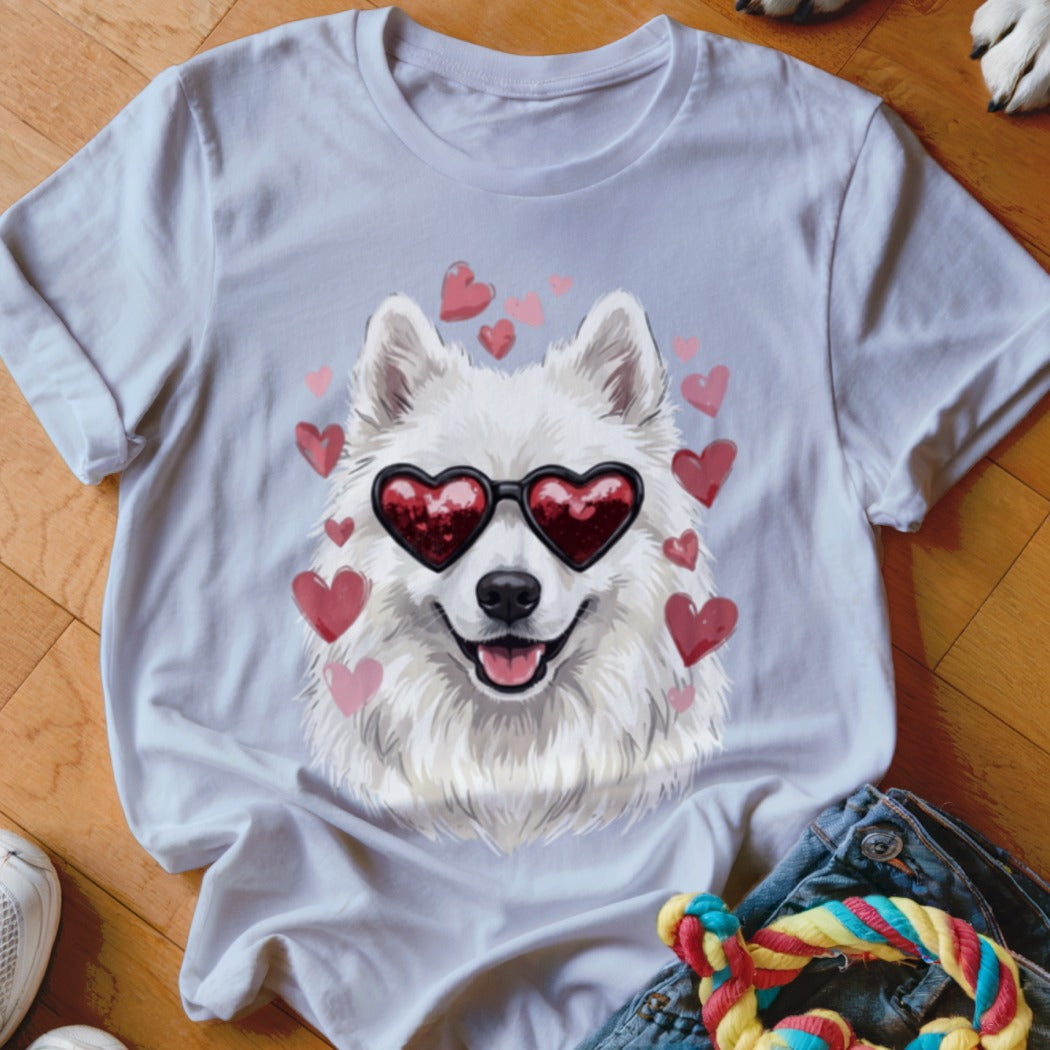 Light purple t-shirt featuring a graphic of a white fluffy dog wearing heart-shaped sunglasses surrounded by pink hearts.