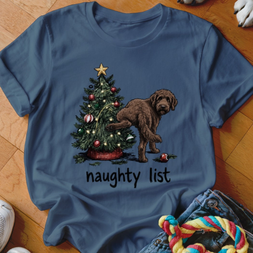 Brown doodle dog near Christmas tree with "naughty list" text.