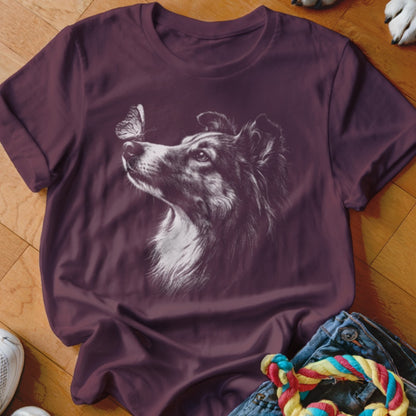 Maroon crewneck t-shirt featuring a white line art graphic of a dog looking at a butterfly.