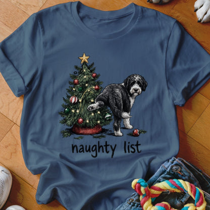 Black and white dog next to a Christmas tree with "naughty list" text.