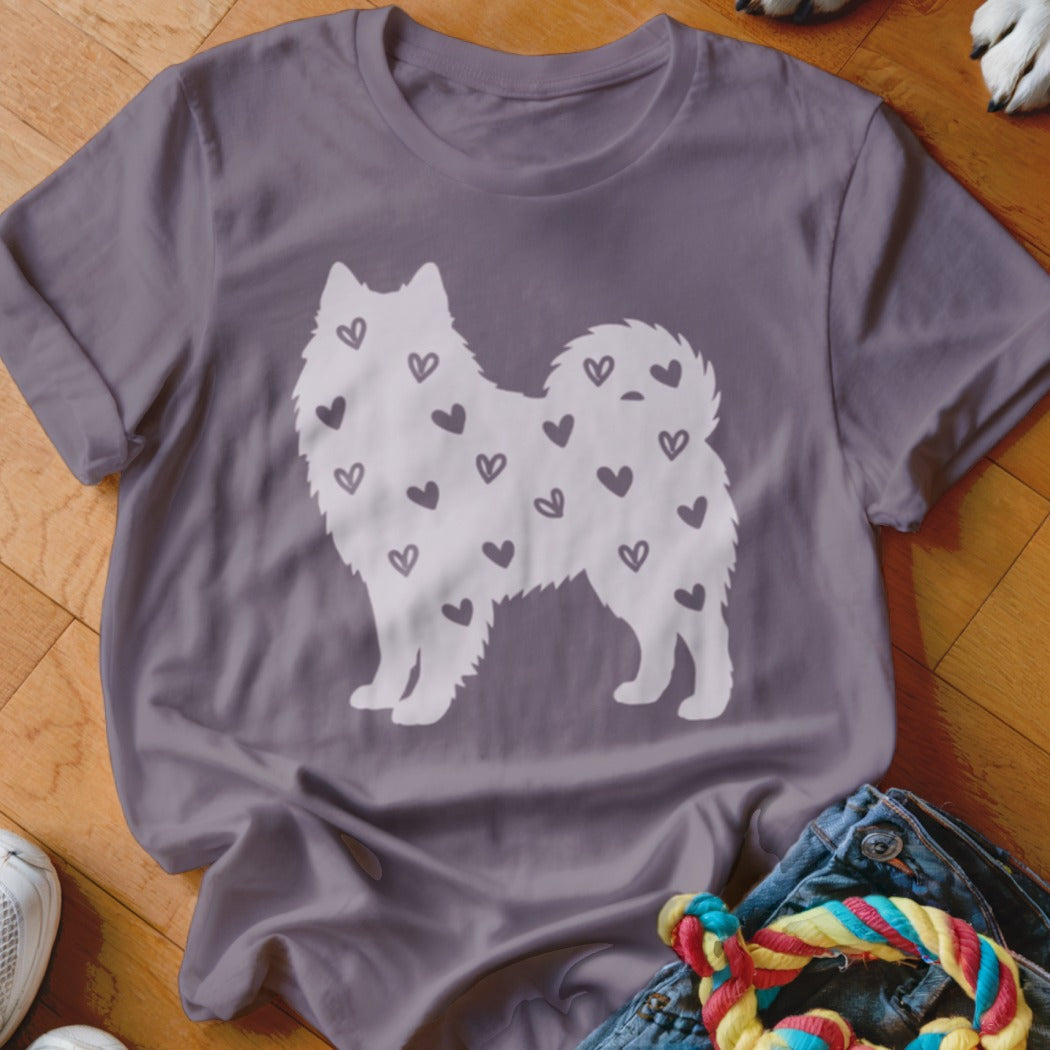 Purple t-shirt with white fluffy dog silhouette filled with hearts.
