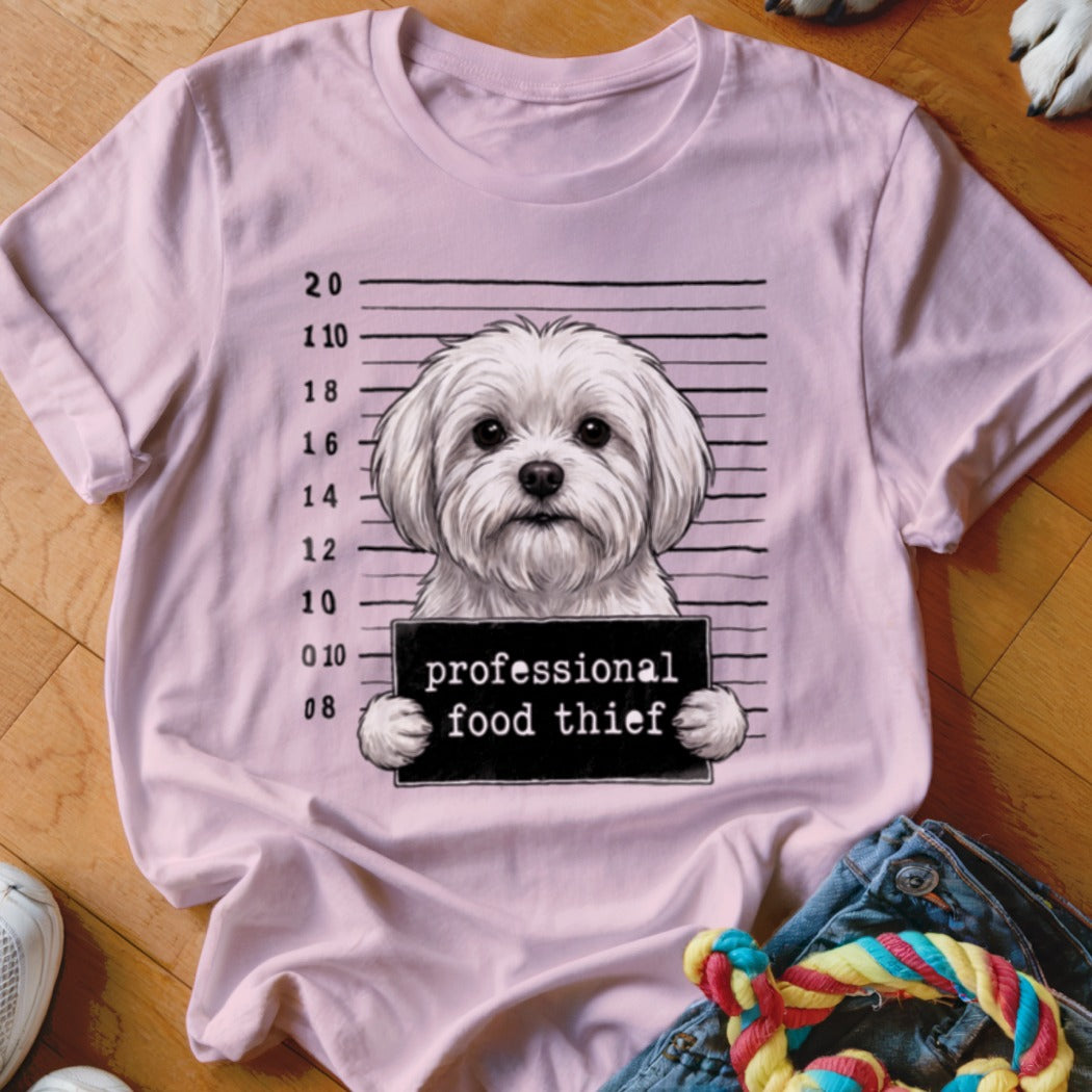 Pink t-shirt with a white dog mugshot graphic reading "professional food thief."