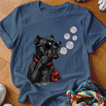 Blue t-shirt featuring a graphic of a black dog wearing sunglasses and blowing soap bubbles.