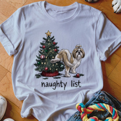 White short-sleeve t-shirt featuring a graphic of a Shih Tzu dog next to a decorated Christmas tree with the text naughty list.
