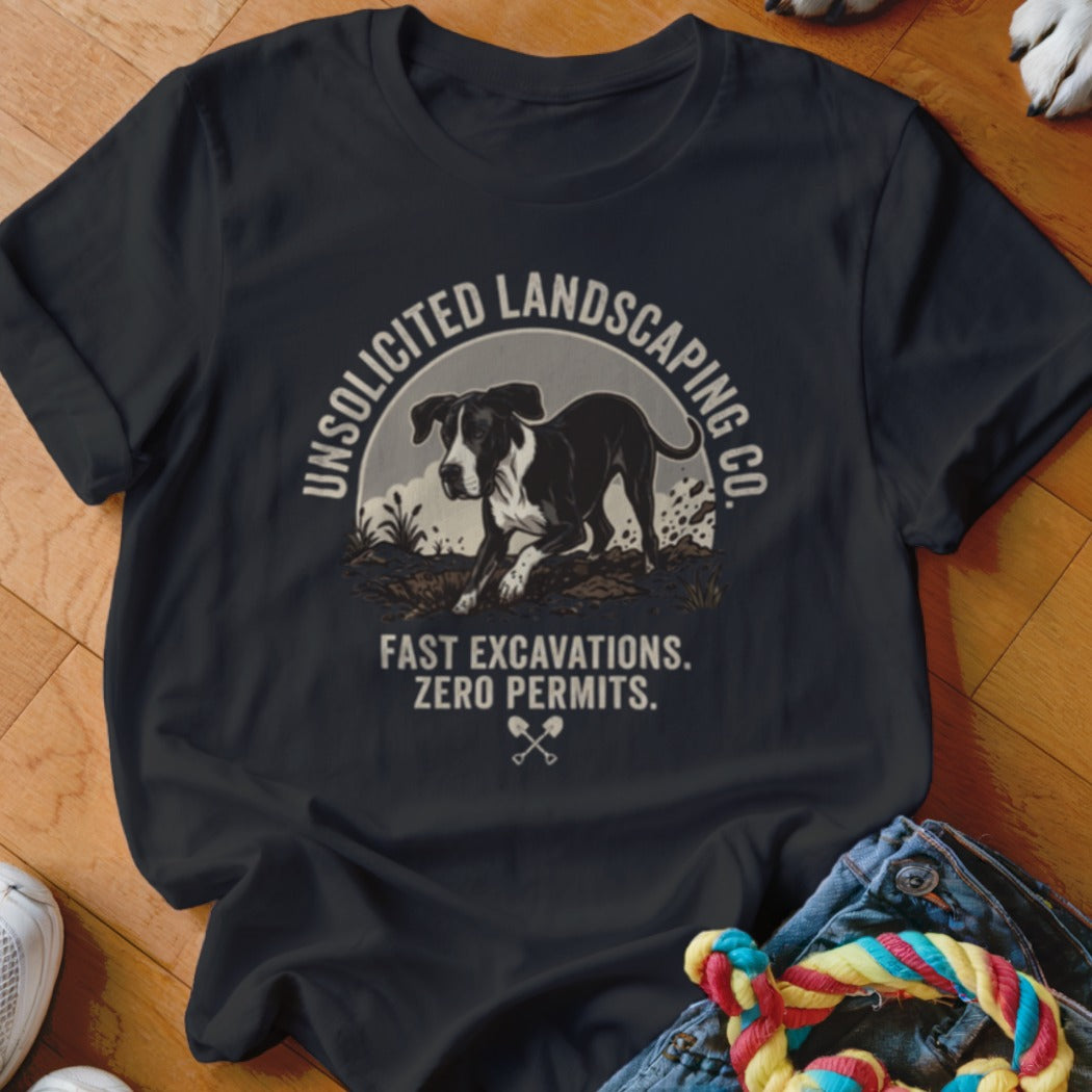 Black t-shirt with graphic of a dog digging and text "Unsolicited Landscaping Co. Fast Excavations. Zero Permits."