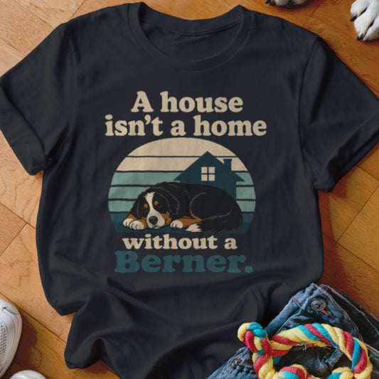 Black t-shirt with vintage sunset design, Bernese Mountain Dog, and text "A house isn't a home without a Berner."