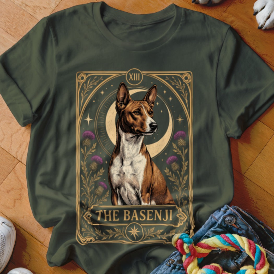 Dark green t-shirt featuring a tarot card style graphic of a Basenji dog with purple thistles and a crescent moon.