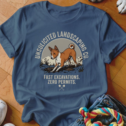 T-shirt graphic of dog digging with text "Unsolicited Landscaping Co. Fast Excavations. Zero Permits."