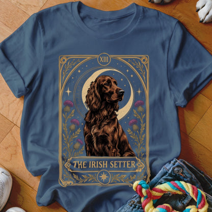 A blue t-shirt features a tarot card style graphic of an Irish Setter dog with a crescent moon.