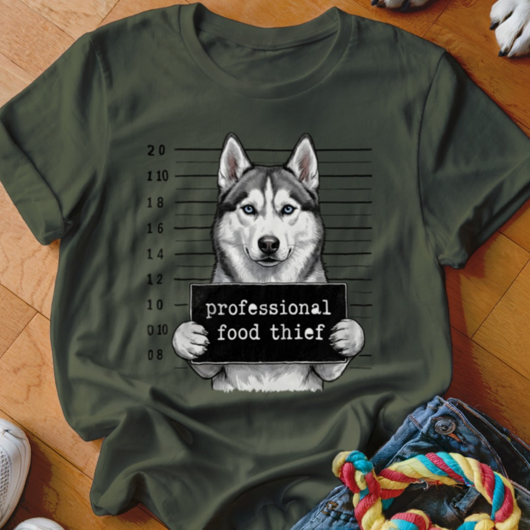 Husky dog mugshot with sign reading "professional food thief."