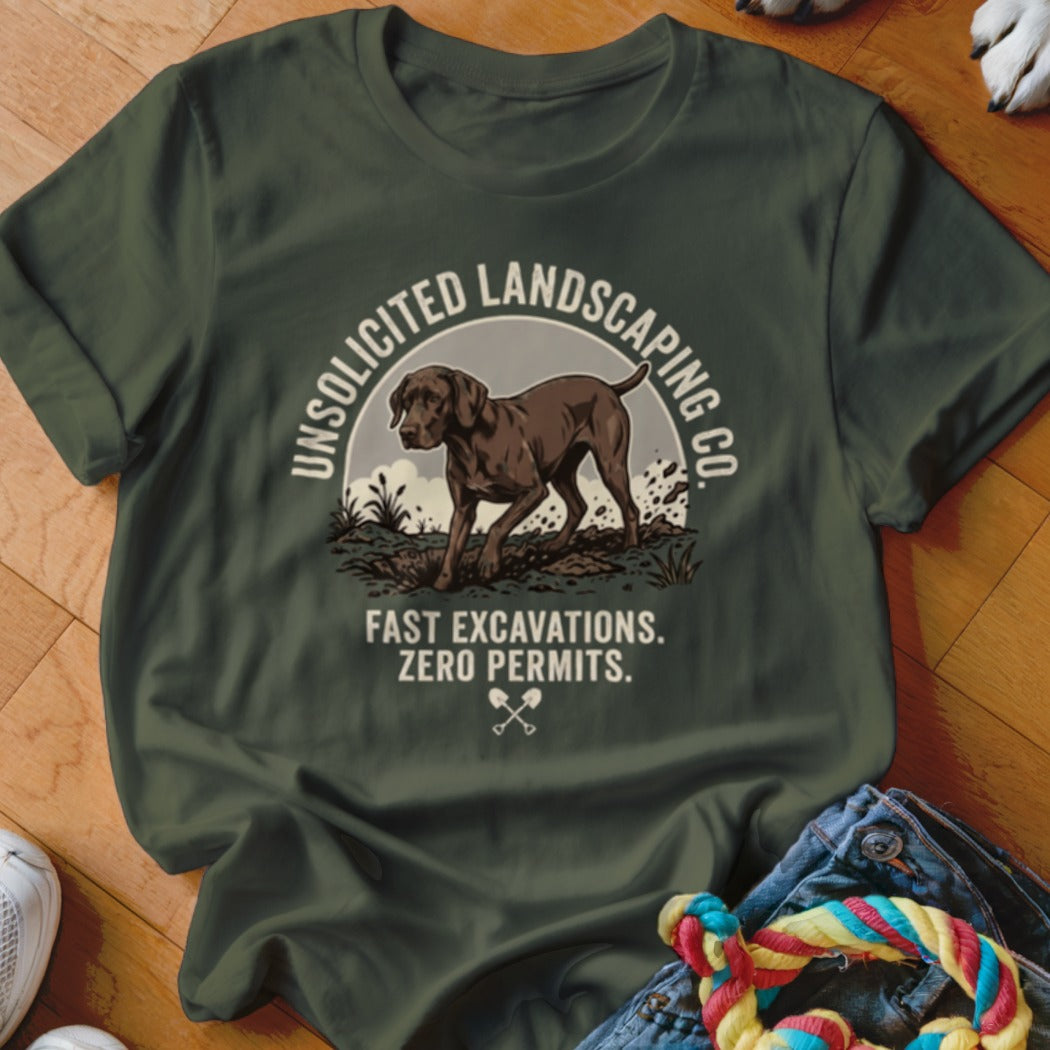 Dark green t-shirt graphic with dog and text: "UNSOLICITED LANDSCAPING CO." and "FAST EXCAVATIONS. ZERO PERMITS."