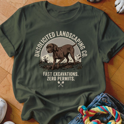 Dark green t-shirt graphic with dog and text: "UNSOLICITED LANDSCAPING CO." and "FAST EXCAVATIONS. ZERO PERMITS."