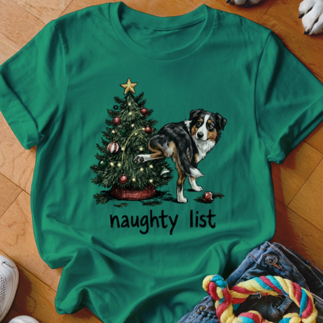 Australian Shepherd peeing on a Christmas tree with "naughty list" text.