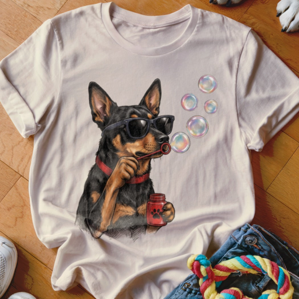 Off-white t-shirt featuring a graphic of a black dog wearing sunglasses and blowing bubbles.