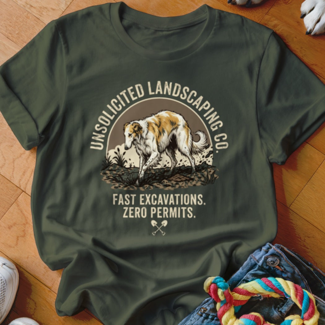 Green t-shirt with a graphic of a Borzoi dog and text "Unsolicited Landscaping Co. Fast Excavations. Zero Permits."