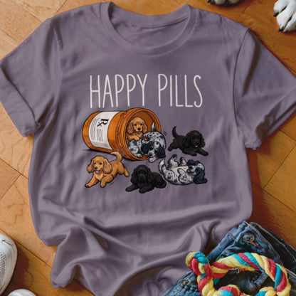 T-shirt with "Happy Pills" text and puppies spilling out of a prescription bottle.