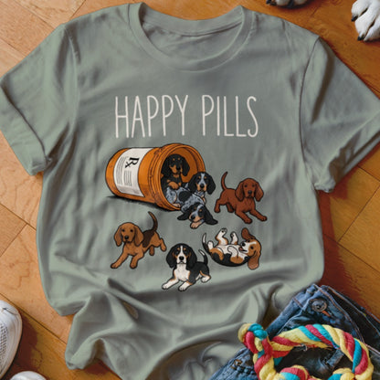 T-shirt with scattered puppies spilling from a pill bottle, reading "HAPPY PILLS".