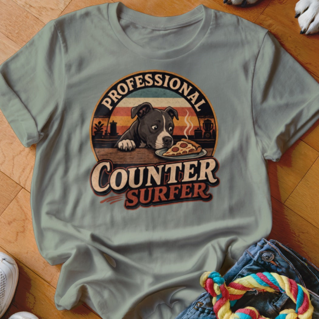 T-shirt graphic: pit bull eyeing pizza with text "Professional Counter Surfer".
