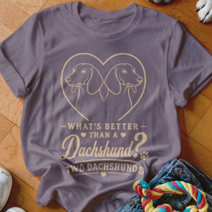 Purple t-shirt with heart featuring two dachshunds and text "What's better than a Dachshund? Two Dachshunds."