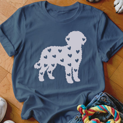Blue t-shirt with white silhouette of a dog covered in small dark blue hearts.