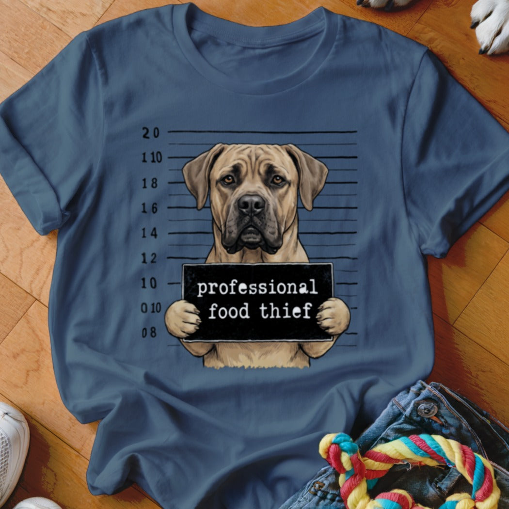 Dog mugshot with "professional food thief" sign and height markings.