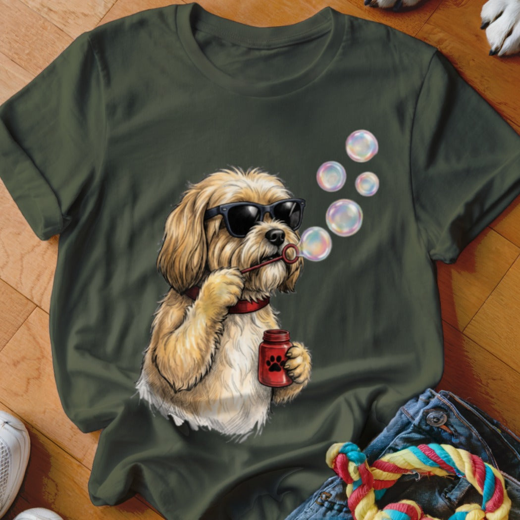 Dark green t-shirt featuring a graphic of a blonde dog in sunglasses blowing bubbles.