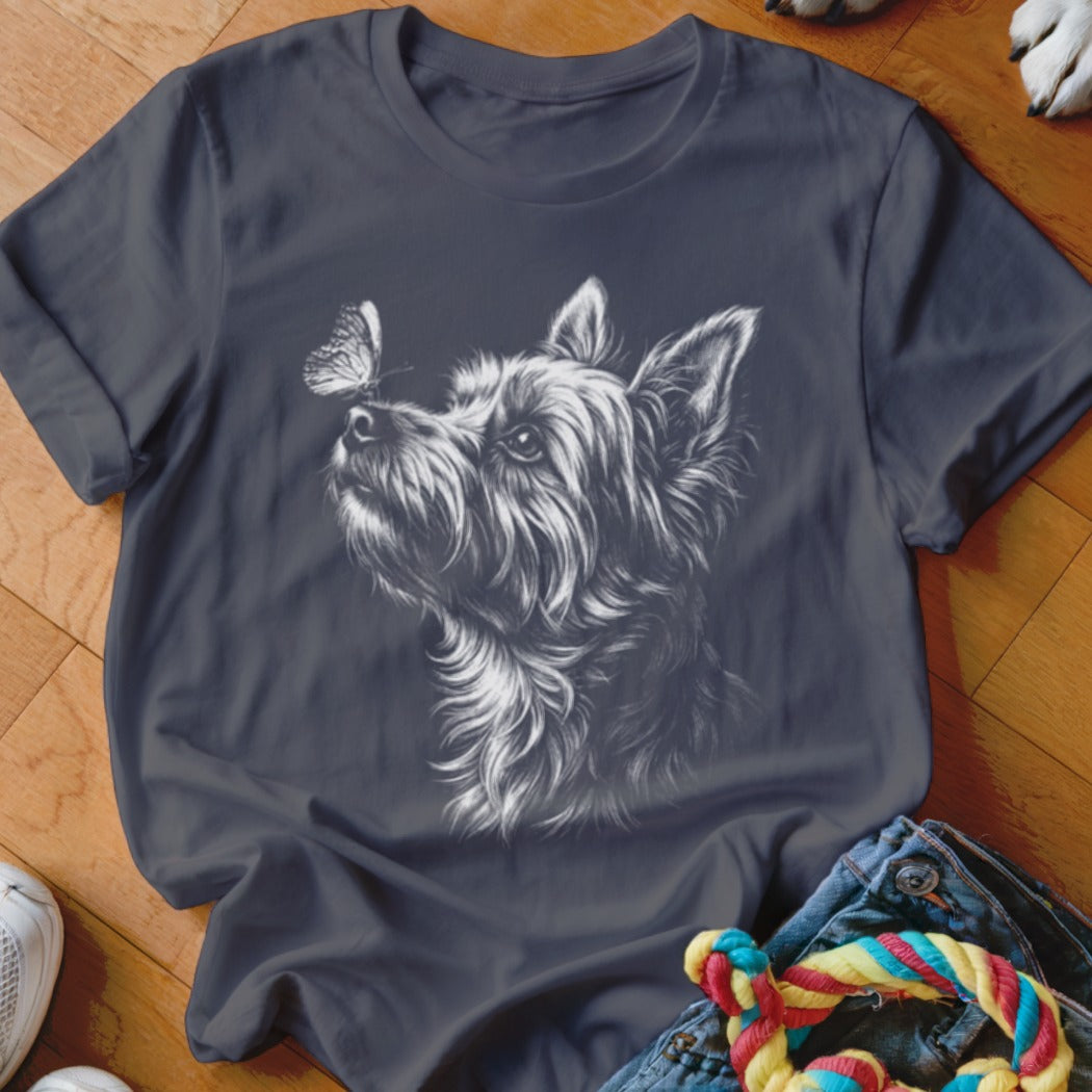 Dark gray t-shirt featuring a white sketch of a terrier dog looking at a butterfly.