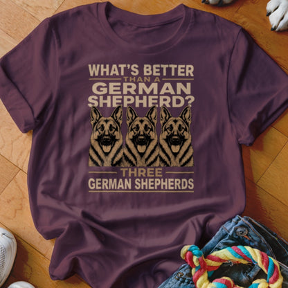 Burgundy t-shirt with three German Shepherds and text "What's Better Than a German Shepherd? Three German Shepherds."