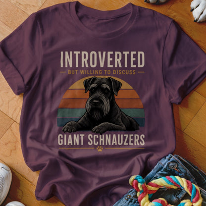 Burgundy t-shirt with text "INTROVERTED BUT WILLING TO DISCUSS GIANT SCHNAUZERS" and dog illustration.