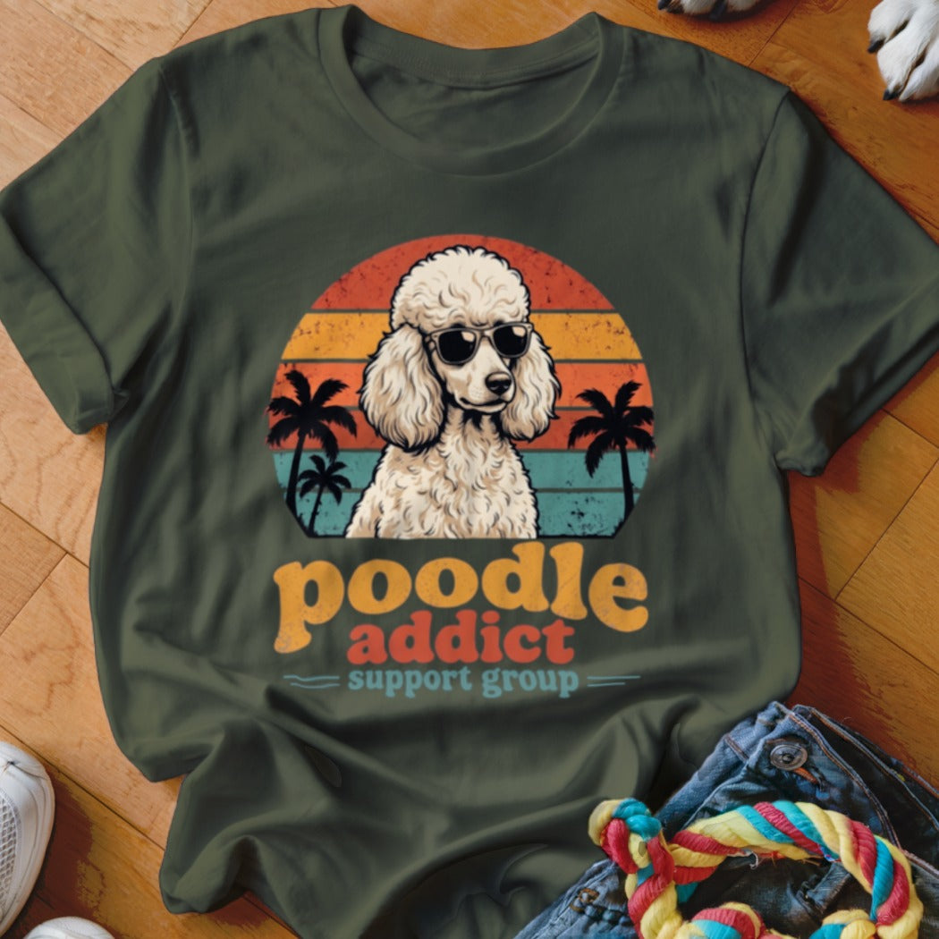 Dark green t-shirt with a retro poodle wearing sunglasses, palm trees, and sunset graphic.