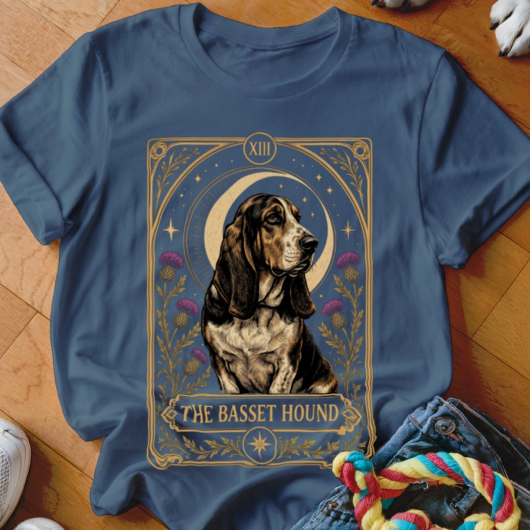 Navy blue t-shirt featuring a tarot card graphic of a Basset Hound and purple thistles.